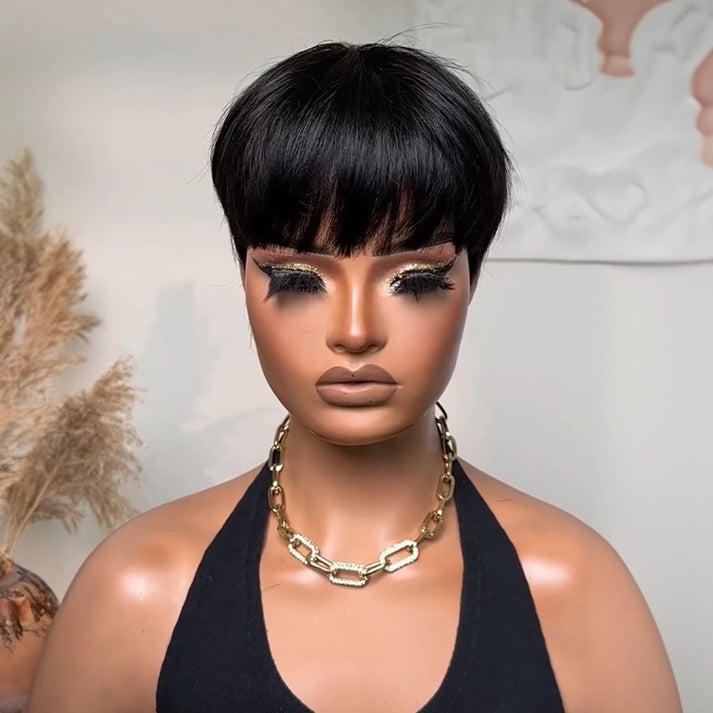 Vintage Chic Pixie Cut with Natural Hair Full Bangs Drawn Sideburns