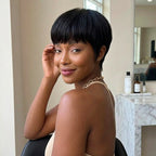 Vintage Chic Pixie Cut with Natural Hair Full Bangs Drawn Sideburns