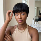 Vintage Chic Pixie Cut with Natural Hair Full Bangs Drawn Sideburns